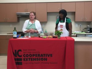 two women conducting Extension Master Food Volunteer training
