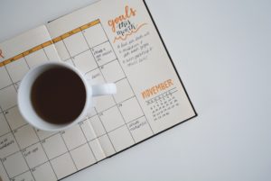 coffee cup and date planner