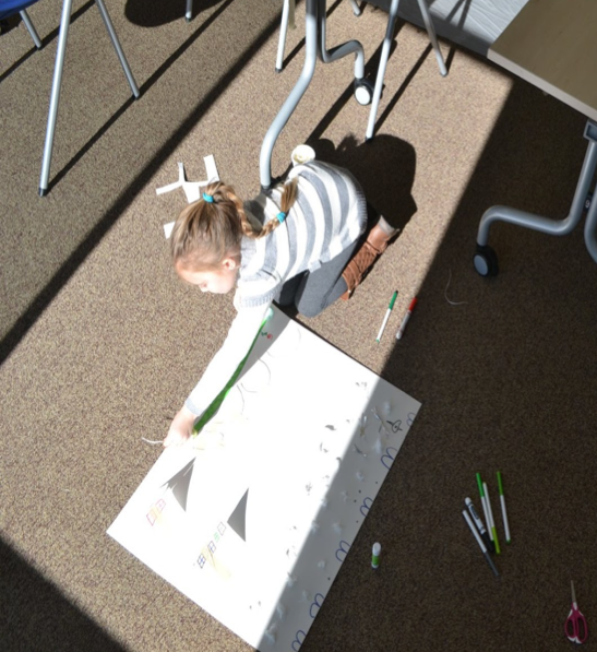 child making a poster