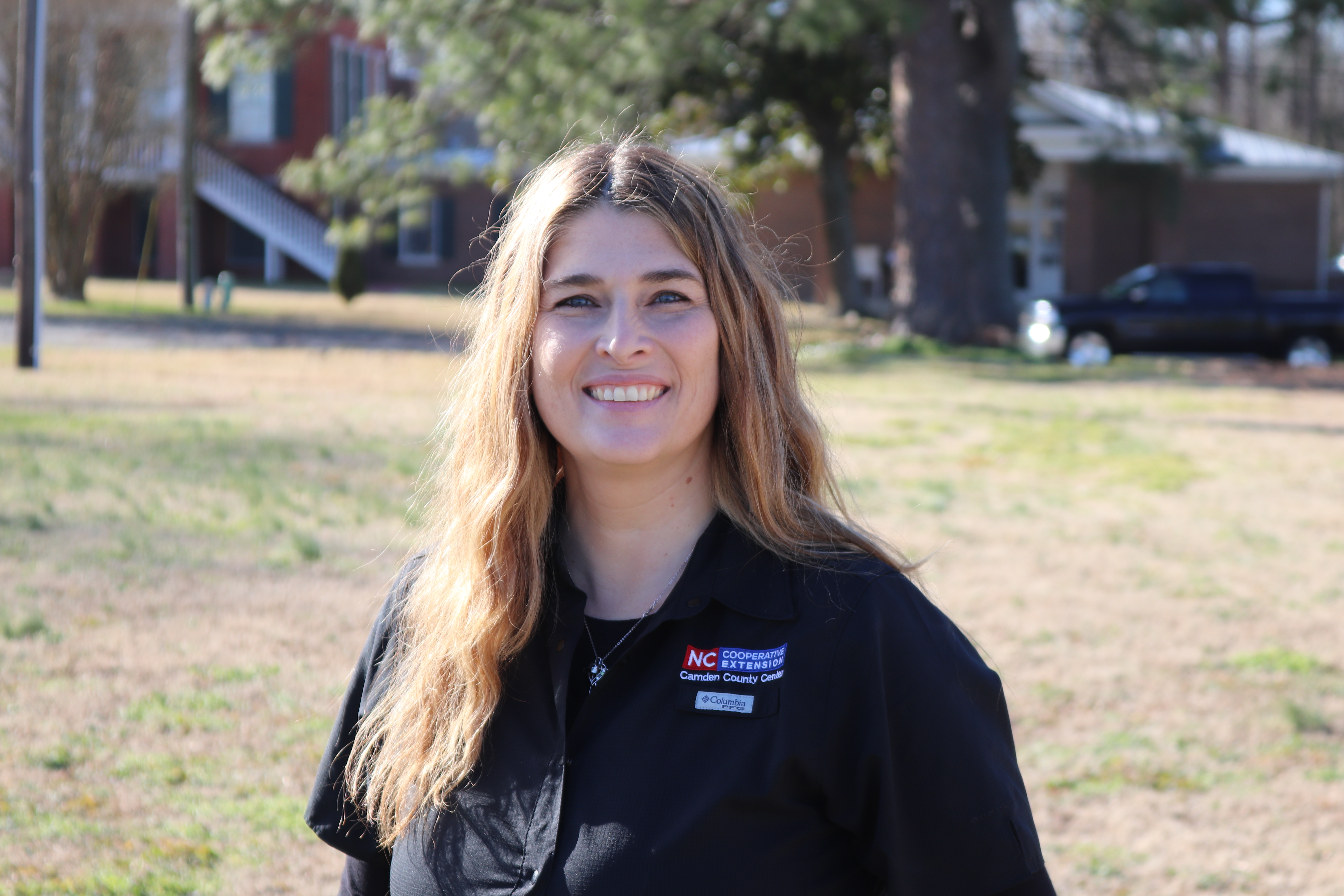 An image of a woman in an N.C. Cooperative Extension shirt.