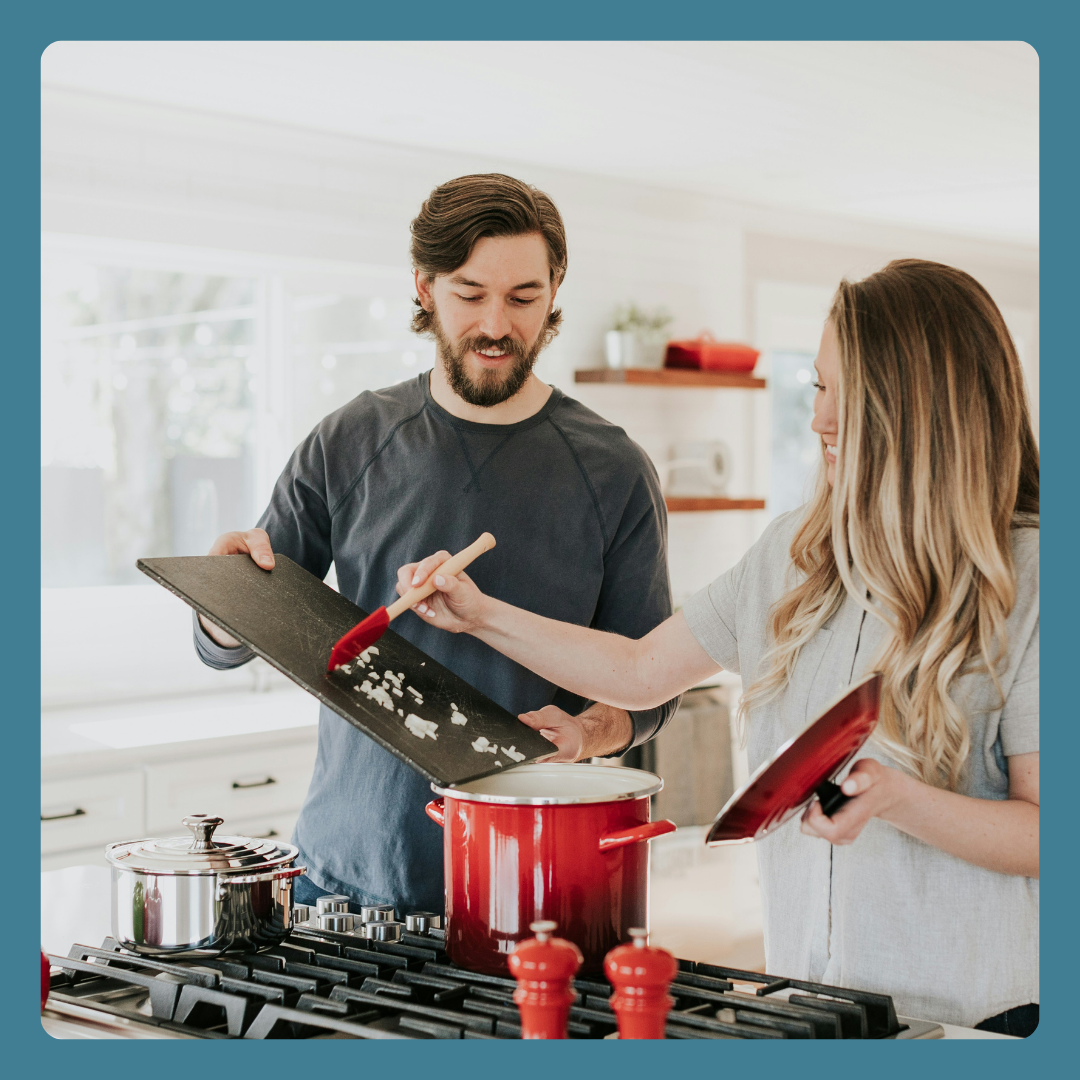 Image of a man and woman cooking together